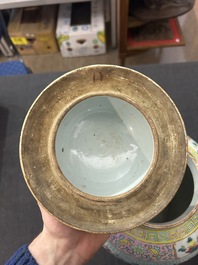 A Chinese famille rose 'antiquities' vase and cover, 19th C.