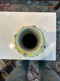 An exceptional pair of Chinese famille rose yellow sgraffito-ground bottle vases with applied design of antiquities, 19th C.