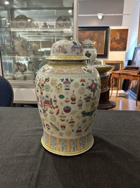 A Chinese famille rose 'antiquities' vase and cover, 19th C.