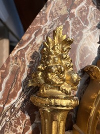 A French gilt bronze Louis XVI style cartel clock with floral design, late 19th C.