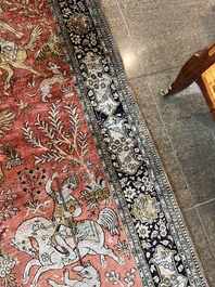 A Persian Qom (Qum/Ghom) silk rug with hunting scenes, 20th C.