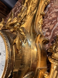 A French gilt bronze Louis XVI style cartel clock with floral design, late 19th C.