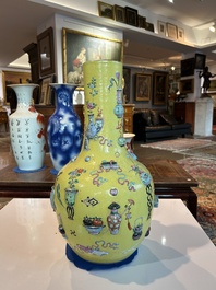 An exceptional pair of Chinese famille rose yellow sgraffito-ground bottle vases with applied design of antiquities, 19th C.