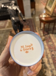 A 27-piece porcelain coffee service with the arms of the Second French Empire under Napoleon III, S&egrave;vres mark, France, 19th C.