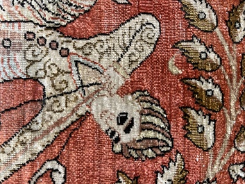 A Persian Qom (Qum/Ghom) silk rug with hunting scenes, 20th C.