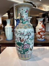 A Chinese famille rose vase with roosters among blossoming branches, 19th C.