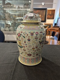 A Chinese famille rose 'antiquities' vase and cover, 19th C.