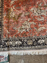 A Persian Qom (Qum/Ghom) silk rug with hunting scenes, 20th C.