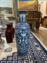 A pair of Chinese famille rose vases and a tall blue and white vase, 19th/20th C.