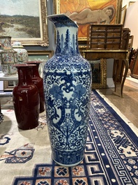 A pair of Chinese famille rose vases and a tall blue and white vase, 19th/20th C.