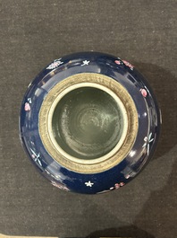 A pair of Chinese blue ground jars with enamelled decoration of butterflies and flowers, 19th C.