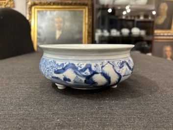 A Chinese blue and white tripod censer with figures in a landscape, 19th C.