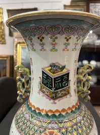 A Chinese famille rose 'antiquities' vase and a vase with figures in a garden, 19th/20th C.