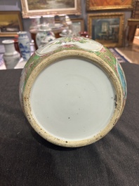 A Chinese bottle-shaped Canton famille rose vase with palace scenes and birds and butterflies among blossoming branches, 19th C.