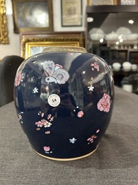 A pair of Chinese blue ground jars with enamelled decoration of butterflies and flowers, 19th C.