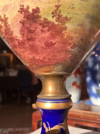 Een paar grote S&egrave;vres porseleinen vazen met allegorie&euml;n van 'De oogst' en 'De visvangst' op verguld bronzen monturen, Frankrijk, 19de eeuw