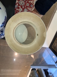 A pair of Chinese blue and white vases and covers with magpies among peonies, 19th C.