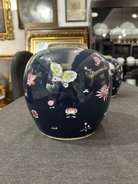 A pair of Chinese blue ground jars with enamelled decoration of butterflies and flowers, 19th C.