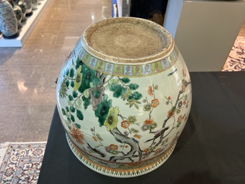 A Chinese famille verte fish bowl with birds among blossoming branches, 19th C.