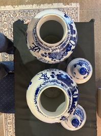 A pair of Chinese blue and white vases and covers with magpies among peonies, 19th C.