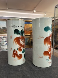 Two Chinese iron-red 'Buddhist lions' hat stands, 19th/20th C.