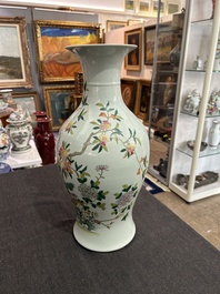 A pair of Chinese famille rose vases and a tall blue and white vase, 19th/20th C.