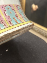 A Chinese famille rose 'antiquities' vase and cover, 19th C.