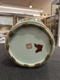 A pair of Chinese famille rose vases and a tall blue and white vase, 19th/20th C.