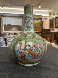 A Chinese bottle-shaped Canton famille rose vase with palace scenes and birds and butterflies among blossoming branches, 19th C.