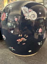 A pair of Chinese blue ground jars with enamelled decoration of butterflies and flowers, 19th C.