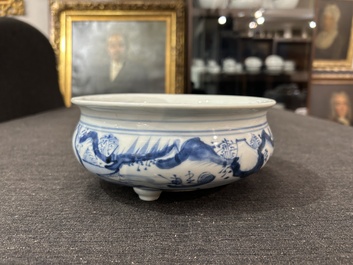 A Chinese blue and white tripod censer with figures in a landscape, 19th C.