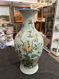 A pair of Chinese famille rose vases and a tall blue and white vase, 19th/20th C.
