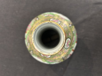 A Chinese bottle-shaped Canton famille rose vase with palace scenes and birds and butterflies among blossoming branches, 19th C.