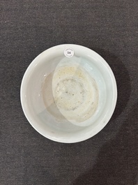 A Chinese blue and white tripod censer with figures in a landscape, 19th C.