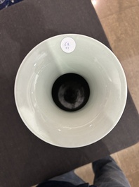 A pair of Chinese famille rose vases and a tall blue and white vase, 19th/20th C.