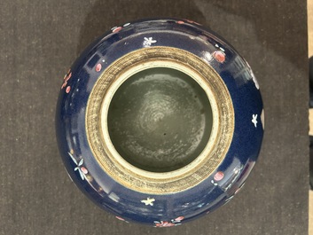 A pair of Chinese blue ground jars with enamelled decoration of butterflies and flowers, 19th C.