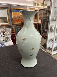 A pair of Chinese famille rose vases and a tall blue and white vase, 19th/20th C.