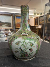 A Chinese bottle-shaped Canton famille rose vase with palace scenes and birds and butterflies among blossoming branches, 19th C.
