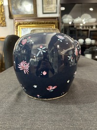 A pair of Chinese blue ground jars with enamelled decoration of butterflies and flowers, 19th C.