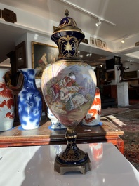 Een paar grote S&egrave;vres porseleinen vazen met allegorie&euml;n van 'De oogst' en 'De visvangst' op verguld bronzen monturen, Frankrijk, 19de eeuw