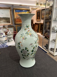 A pair of Chinese famille rose vases and a tall blue and white vase, 19th/20th C.