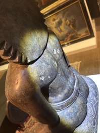 An Indian polished black marble sculpture of a Jina seated in dhyanasana on an ornate cushion, probably Gujarat, 15th C.