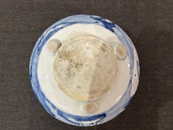 A Chinese blue and white tripod censer with figures in a landscape, 19th C.