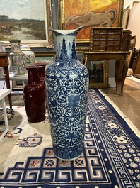A pair of Chinese famille rose vases and a tall blue and white vase, 19th/20th C.