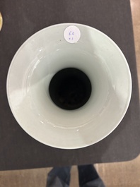 A pair of Chinese famille rose vases and a tall blue and white vase, 19th/20th C.