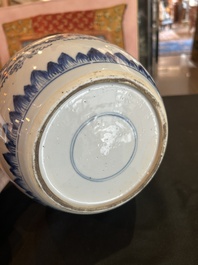 A Chinese blue and white jar with reticulated wooden cover, Kangxi