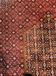 A Persian Bidjar rug with floral design, wool on cotton, 20th C.