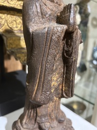 A Chinese cast iron sculpture of a Luohan, probably Ming