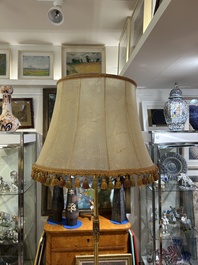 A reticulated Chinese wooden stand with marble top and a French gilt brass and champlev&eacute; 'elephant' lamp, 20th C.