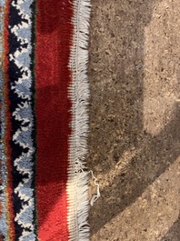 A Persian Bidjar rug with floral design, wool on cotton, 20th C.